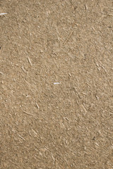  Construction material made with dry straw and clay.