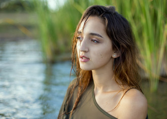 summer portrait of a swimming girl, emotional portrait of a girl in the water