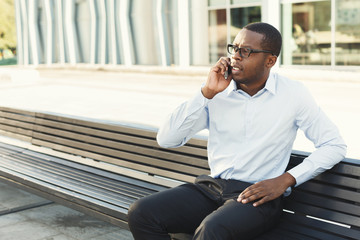 Black businessman outdoors in smart casual ware