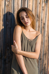 Fototapeta premium Girl in a light dress on the straps, sexy grunge girl sensually