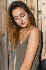 Naklejka premium Girl in a light dress on the straps, sexy grunge girl sensually