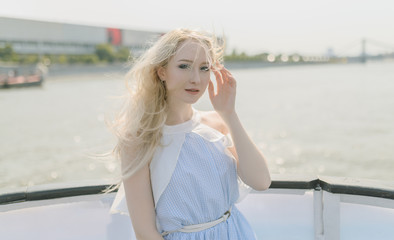 Young woman enjoy a boat tour through river.