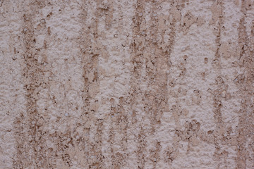 Brown plastered handmade rough wallpaper. Beautiful decorative plastered wall. Rough texture.