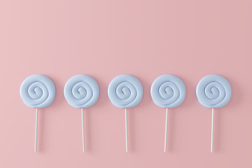 Blue candy on pastel pink background. minimal concept