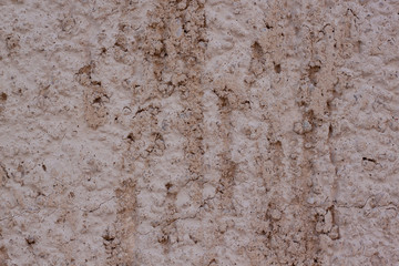 Brown plastered handmade rough wallpaper. Beautiful decorative plastered wall. Copy space for your text.