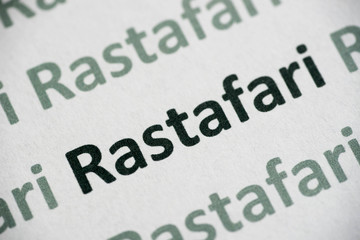 Fototapeta premium word Rastafari printed on paper macro