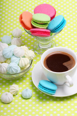 A cup of coffee and macaroons ready for breakfast