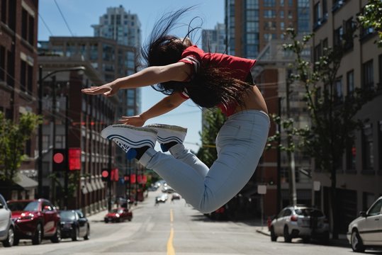 Female street dancer dancing in the street