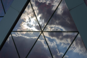 Clouds and sky reflected on the building