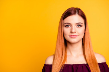 Charming and lovely young woman looks at camera isolated on yell