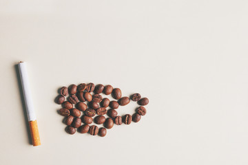 Cup of coffee made of coffee beans and cigarette on bright yellow background, stressful morning, hard work, unhealthy eating habits, copy space for your text