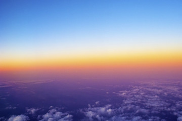 a sun setting on a plane.