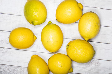 yellow lemon on wooden table 