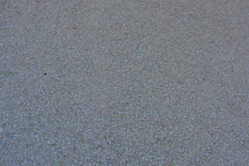 Concrete wall with small gray stones in it on the whole square