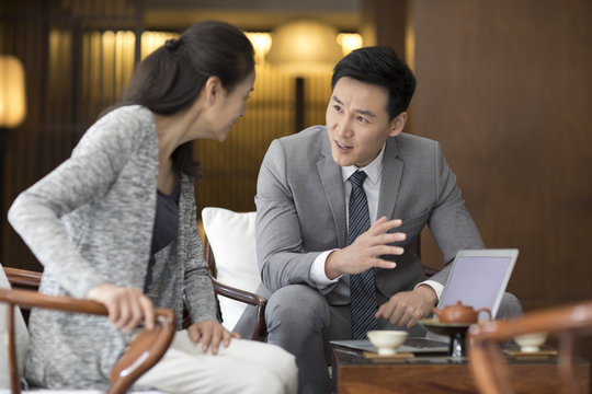 Confident businessman talking with a mature woman