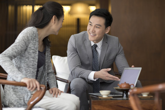 Confident businessman talking with a mature woman