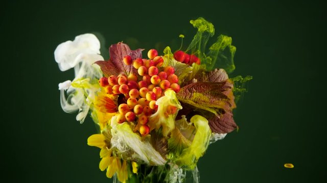 Amazing spreading of paint on beautiful autumn bouquet.