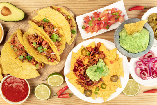 Overhead photo of an assortment of various Mexican dishes