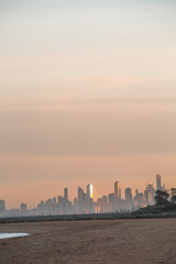 Fototapeta na wymiar View of City of Melbourne at Sunrise from Brighton Beach