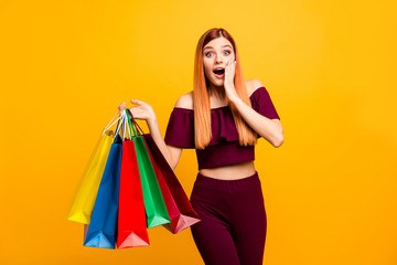 Black friday! Wondered young woman with surprised face holds his