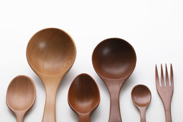 Set of wooden spoons on white background