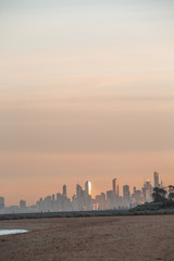 Fototapeta premium View of City of Melbourne at Sunrise from Brighton Beach