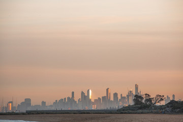 Fototapeta premium View of City of Melbourne at Sunrise from Brighton Beach