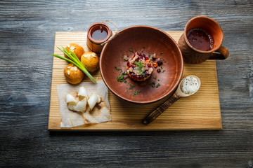 wooden table topped with plates of traditional ukrainian food