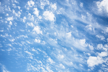 Blue sky with fluffy white clouds. Sky background