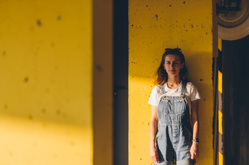 Closed up picture of Girl in a jeans overalls in the parking