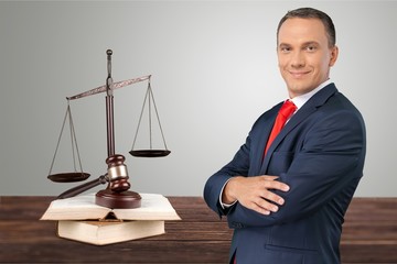 Portrait of happy businessman on background