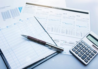 Calculator, pan and the financial report