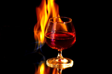 Cognac glass with the burning fire flames