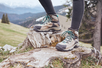 Hiking boots on stump