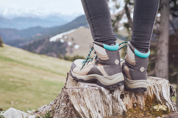 Hiking boots on stump