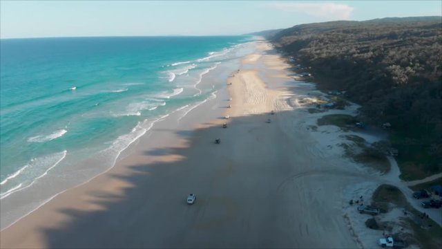 Aerial view of vehicles driving on the beach, Double Island Australia