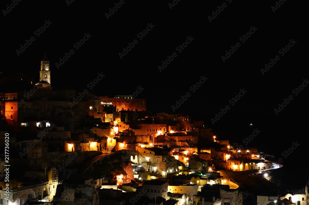 Wall mural panoramic view of ancient town of matera (sassi di matera) by night. basilicata, italy.