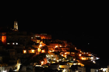 Fototapeta na wymiar Panoramic view of ancient town of Matera (Sassi di Matera) by night. Basilicata, Italy.