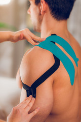 Kinesio taping for shoulder pain - obrazy, fototapety, plakaty