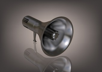 A silver speaker on a gray