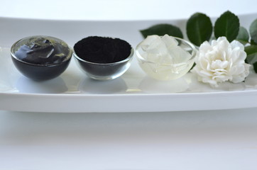 Fresh aloe vera gel with cosmetic black activated charcoal powder and beauty face mask mixture