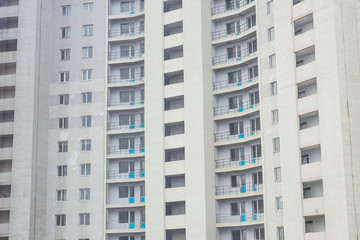 New block of modern apartments with balconies in the city.