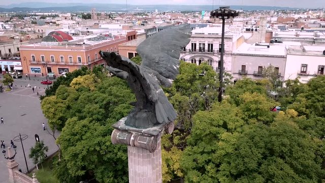 Aerial 360 travel of eagle landmark in Aguascalientes, Mexico.