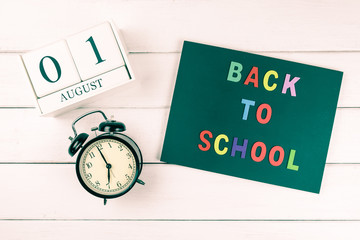 Top view of back to school wording on wood background