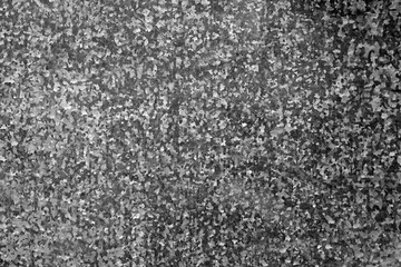 Metal plate surface in black and white.