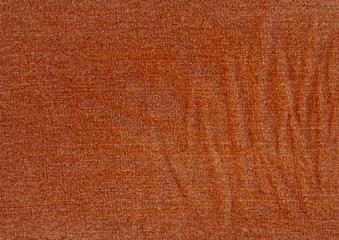 Fototapeta premium Jeans texture in orange tone.