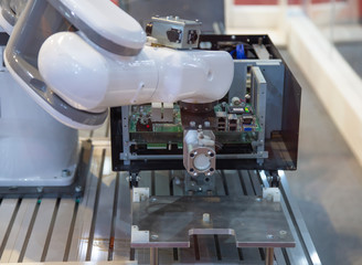 High precision automated robot assembly electronics part on PCB. Electronic industry	