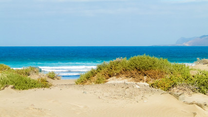 Fototapeta na wymiar Beach and Atlantic Ocean in Caleta de Famara, Lanzarote Canary Islands.