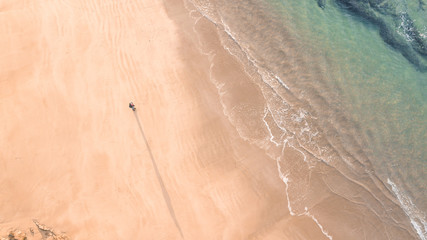 Aerial View of Waves and People and Beach Along Great Ocean Road, Victoria, Australia at Sunrise
