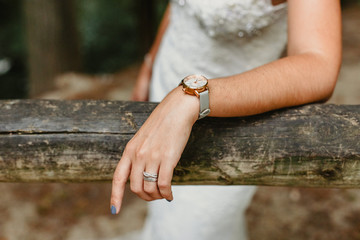 Detail of a white and elegant wedding dress.